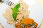 Italian Gnocchi With Seafood Sauce With Crab And Basil Stock Photo