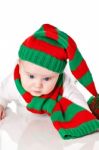 Baby With Christmas Hat And Scarf Stock Photo