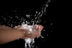 à¹‰hand And Splashing Water On Black Stock Photo