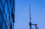 High Business Building With Metal Crane At Dawn Stock Photo