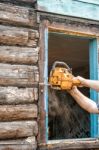 Man Sawing A Window Stock Photo