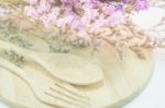 Wooden Set Of Food Utensil And Static Flower Stock Photo