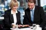 Corporates Discussing Business Over A Coffee Stock Photo