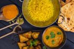 Indian Pilau Rice In Balti Dish Served With Chicken Tikka Masala Stock Photo