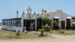 Woman Leaving A Beach Restaurant In Puerto Banus Stock Photo