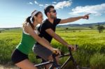 Happy Young  Couple On A Bike Ride In The Countryside Stock Photo