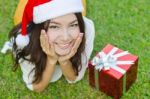 Santa Claus Hat With Red Christmas Gift Box Stock Photo