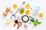 The Ingredients For Homemade Pesto Pasta On White Wooden Backgro Stock Photo