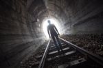 Man In A Tunnel Looking Towards The Light Stock Photo