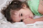 Small Child Holding A Finger In His Mouth. Studio Photos. Close- Stock Photo