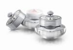 Two Silver Deluxe Cosmetic Jar On White Background Stock Photo