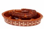 Traditional Portuguese Pottery For Grilling Chorizos Stock Photo