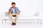 Man Eating While Watching Tv Stock Photo