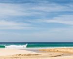 Beach, Sea And Cloudy Blue Sky Stock Photo