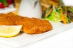 Classic Milanese Veal Cutlets And Vegetables Stock Photo