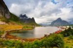 Norway Village On A Fjord. Nordic Cloudy Summer Day Stock Photo