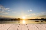 Wood Table Top On Blur Sunrise Background/ Use For Montage On Product Display Stock Photo