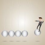 Cartoon Businessman Hanging On Newton's Cradle Stock Photo