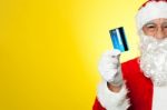 Cropped Image Of Aged Santa Holding Credit Card Stock Photo