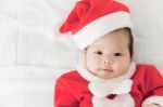 Little Girl With Santa Costume Stock Photo