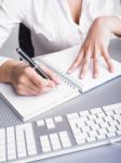 Business Lady Writing On Notebook Stock Photo