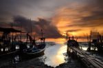 Fishing Boat With Sunrise Background Stock Photo