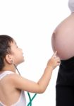 Asian Boy Touching His Mother Tummy Stock Photo