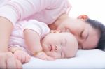 Newborn Baby Girl Sleeping In Mother Arm Stock Photo