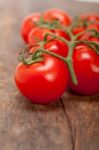 Fresh Cherry Tomatoes On A Cluster Stock Photo