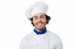 Young Male Chef Wearing Toque Stock Photo