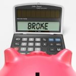 Broke Calculator Shows Credit Trouble And Debt Stock Photo