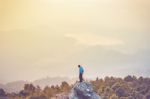 Instagram Filter Young Man Asia Tourist At Mountain Is Watching Over The Misty And Foggy Morning Sunrise, Travel Trekking Stock Photo