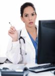 Serious Young Doctor Looking Strangely At Us Stock Photo