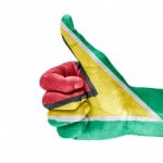 Flag Of Guyana On Thumb Up Hand Stock Photo