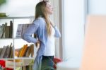 Beautiful Young Businesswoman Taking A Break In The Office Stock Photo