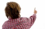 Back Pose Of Boy Pointing Stock Photo