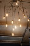 Antique Light Bulbs Hanging On The Ceiling Stock Photo