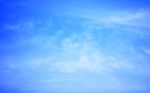 Blue Sky Background With Tiny Clouds Stock Photo