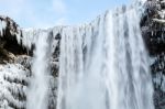 View Of Skogafoss Waterfall In Winter Stock Photo