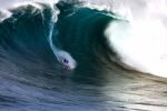 Surfing A Wave Stock Photo