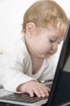 Lovely Curious Child With Laptop Stock Photo