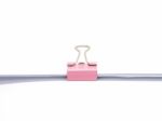 Pink Paperclip Attached On White Paper Isolated Stock Photo
