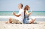 Meditating At The Beach Stock Photo