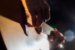 Playing Acoustic Guitar On Low-key Lighting Background Stock Photo