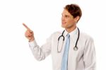 Young Doctor Pointing At Something Stock Photo