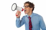 Businessman Using Megaphone Stock Photo