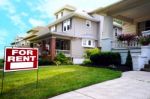 Home For Rent Sign In Front Of Beautiful American House Stock Photo