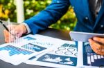 Handsome Businessman Wearing Suit And Using Modern Laptop Outdoo Stock Photo