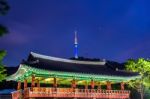 Namsangol Hannok Village And Seoul Tower Located On Namsan Mountain At Night In Seoul,south Korea Stock Photo