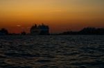 Venice Italy Sunset With Cruise Boat Stock Photo